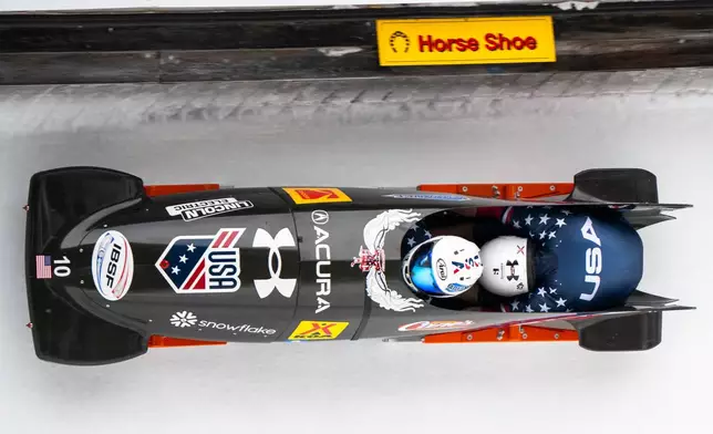 Frank del Duca/ Joshua Williamson of the USA in action during the Men's 2-Bob World Cup, in St. Moritz, Switzerland, Saturday, Jan. 10, 2026. (Mayk Wendt/Keystone via AP)