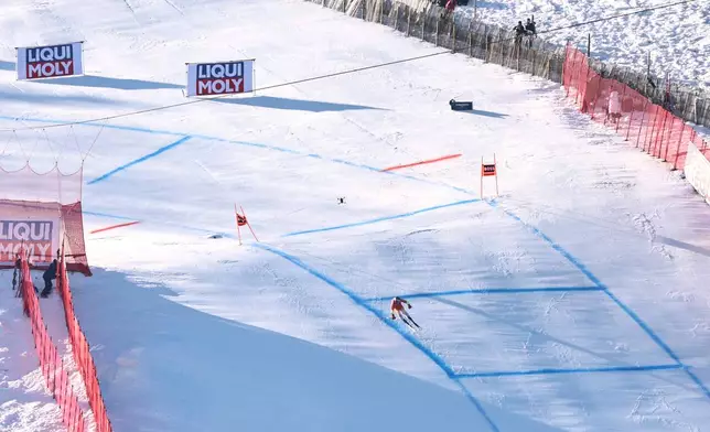 Switzerland's Marco Odermatt speeds down the course during a men's World Cup super-G, in Kitzbuehel, Friday, Jan. 23, 2026. (AP Photo/Marco Trovati)