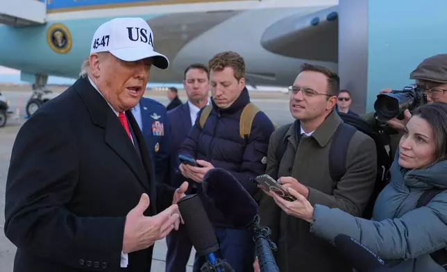 President Donald Trump speaks with reporters at Joint Base Andrews, Tuesday, Jan. 13, 2026, in Joint Base Andrews, Md. (AP Photo/Evan Vucci)