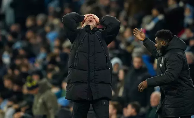 Manchester City's head coach Pep Guardiola, center, reacts after Chelsea's Enzo Fernandez scoring during the English Premier League soccer match between Manchester City and Chelsea in Manchester, England, Sunday, Jan. 4, 2026. (AP Photo/Dave Thompson)