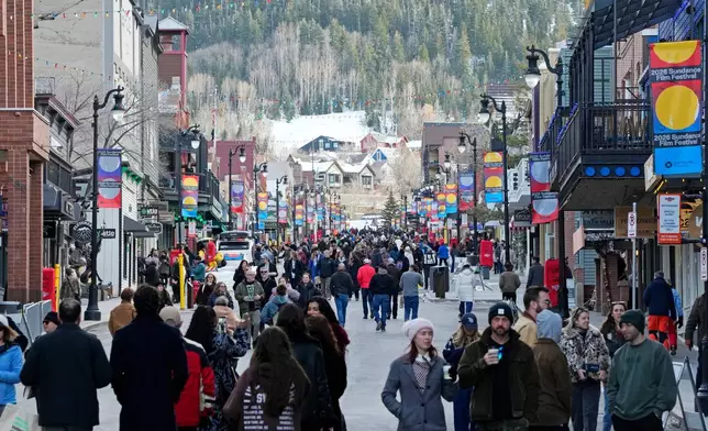 Pedestrians walk down Main Street on the first day of the 2026 Sundance Film Festival on Thursday, Jan. 22, 2026, in Park City, Utah. (Photo by Charles Sykes/Invision/AP)