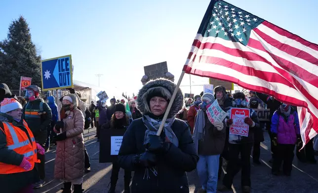 People gather for a protest against ICE outside the Bishop Henry Whipple Federal Building, Friday, Jan. 30, 2026, in Minneapolis. (AP Photo/Adam Gray)