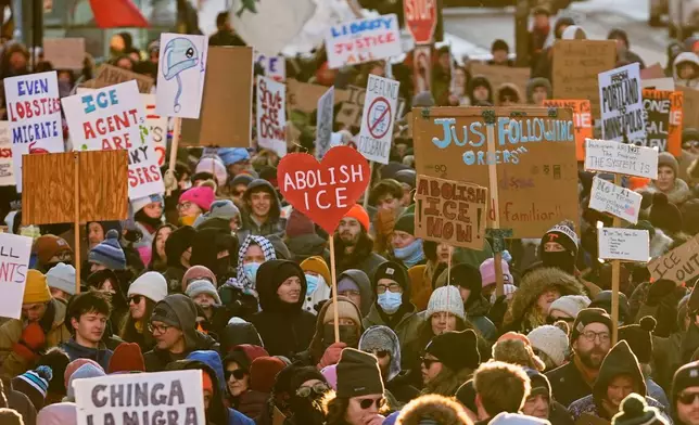 People protest against U.S. Immigrations and Customs enforcement in Portland, Maine, Friday, Jan. 30, 2026. (AP Photo/Robert F. Bukaty)