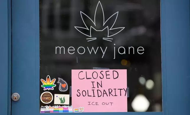 A sign at a cannabis shop indicates it is closed for the general strike to support the state's immigrant community Friday, Jan. 30, 2026, in Portland, Maine. (AP Photo/Robert F. Bukaty)