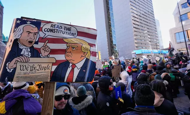 People gather during a protest Friday, Jan. 30, 2026, in Minneapolis. (AP Photo/Alex Brandon)