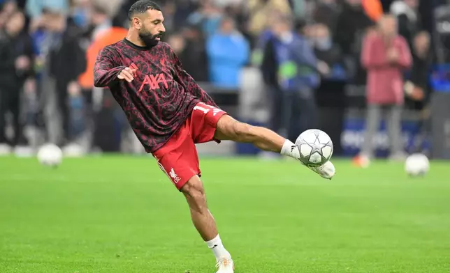 Liverpool's Mohamed Salah warms up prior to the Champions League opening phase soccer match between Marseille and Liverpool in Marseille, France, Wednesday, Jan. 21, 2026. (AP Photo/Philippe Magoni)