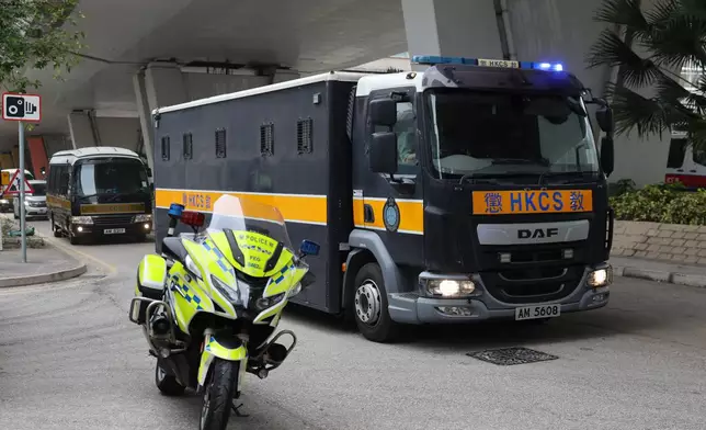 Correctional Services Department vehicles arrive at the West Kowloon Magistrates' Courts, ahead of a hearing to hear arguments about the sentencing of democracy advocate and onetime media magnate Jimmy Lai, in Hong Kong, Monday, Jan. 12, 2026. (AP Photo/May James)