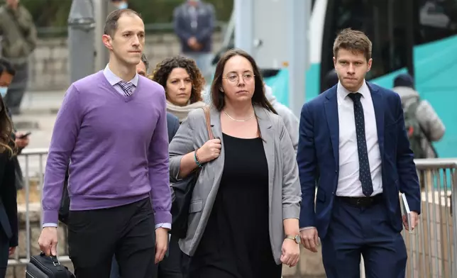 Members of foreign councils arrive at the West Kowloon Magistrates' Courts to attend a hearing to hear arguments about the sentencing of pro-democracy media mogul Jimmy Lai, in Hong Kong, Monday, Jan. 12, 2026. (AP Photo/May James)