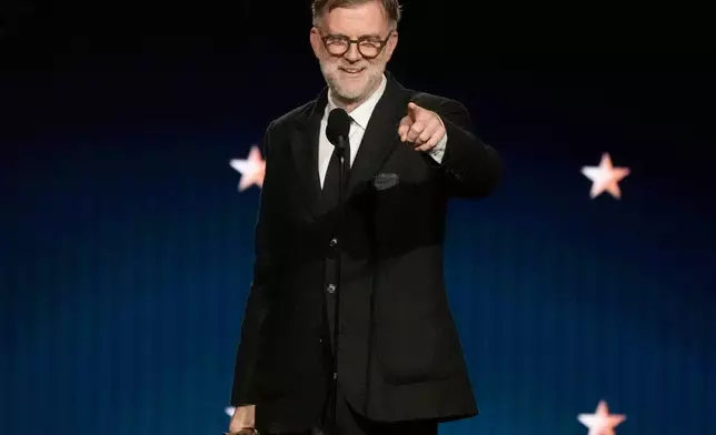 Paul Thomas Anderson accepts the award for best director for "One Battle After Another" during the 31st Annual Critics Choice Awards on Sunday, Jan. 4, 2026, at The Barker Hanger in Santa Monica, Calif. (AP Photo/Chris Pizzello)
