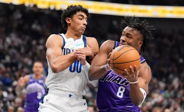 Utah Jazz guard Isaiah Collier (8) drives to the basket against Dallas Mavericks guard Max Christie (00) in the first half of an NBA basketball game in Dallas, Saturday, Jan. 17, 2026. (AP Photo/Tony Gutierrez)