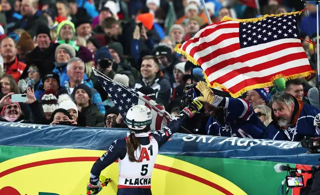 United States' Paula Moltzan reacts at the finish line during an alpine ski, women's World Cup slalom, in Flachau, Austria, Tuesday, Jan. 13, 2026. (AP Photo/Marco Trovati)