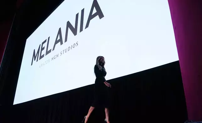 First lady Melania Trump walks from the stage after speaking before the premiere of her movie "Melania" at The John F. Kennedy Memorial Center For The Performing Arts, Thursday, Jan. 29, 2026, in Washington. (AP Photo/Allison Robbert)