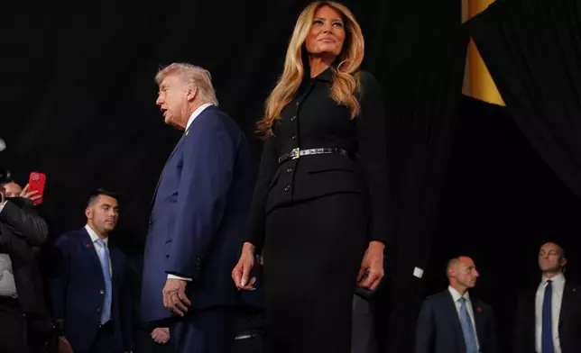 President Donald Trump and first lady Melania Trump arrive for the premiere of her movie "Melania" at The John F. Kennedy Memorial Center For The Performing Arts, Thursday, Jan. 29, 2026, in Washington. (AP Photo/Allison Robbert)