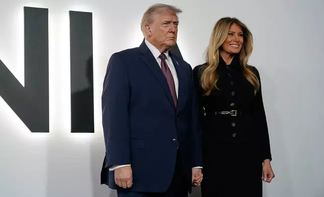 President Donald Trump and first lady Melania Trump arrive for the premiere of her movie "Melania" at The John F. Kennedy Memorial Center For The Performing Arts, Thursday, Jan. 29, 2026, in Washington. (AP Photo/Jose Luis Magana)