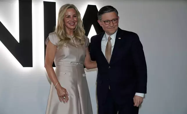 House Speaker Mike Johnson of La., and his wife Kelly arrive for the premiere of first lady Melania Trump's movie "Melania" at The John F. Kennedy Memorial Center For The Performing Arts, Thursday, Jan. 29, 2026, in Washington. (AP Photo/Jose Luis Magana)