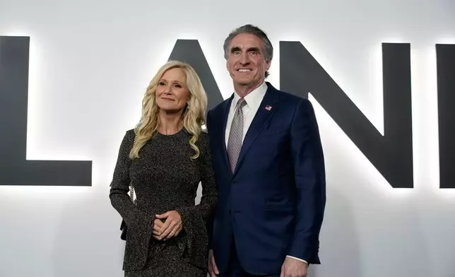Interior Secretary Doug Burgum and his wife Kathryn arrive for the premiere of first lady Melania Trump's movie "Melania" at The John F. Kennedy Memorial Center For The Performing Arts, Thursday, Jan. 29, 2026, in Washington. (AP Photo/Jose Luis Magana)