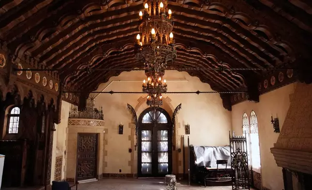 Chandeliers and sunlight illuminate a room at Scotty's Castle, Friday, Jan. 23, 2026, in Death Valley National Park, Calif. (AP Photo/John Locher)