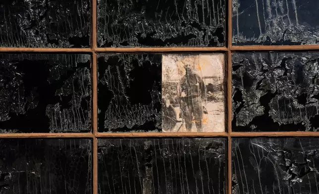 A picture of Albert Johnson is on display in a window at Scotty's Castle, Friday, Jan. 23, 2026, in Death Valley National Park, Calif. (AP Photo/John Locher)
