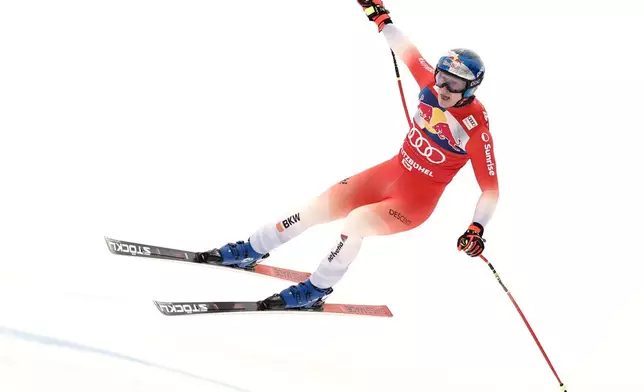 Switzerland's Marco Odermatt speeds down the course during a men's alpine ski World Cup downhill, in Kitzbuehel, Austria, Saturday, Jan. 24, 2026. (AP Photo/Gabriele Facciotti)