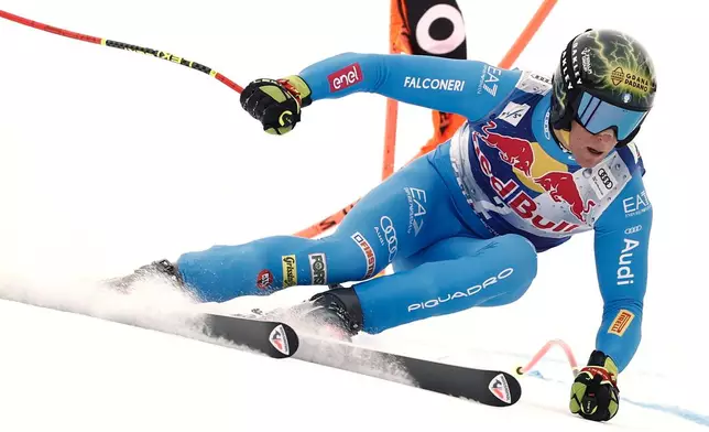 Italy's Giovanni Franzoni speeds down the course during a men's alpine ski World Cup downhill, in Kitzbuehel, Austria, Saturday, Jan. 24, 2026. (AP Photo/Gabriele Facciotti)