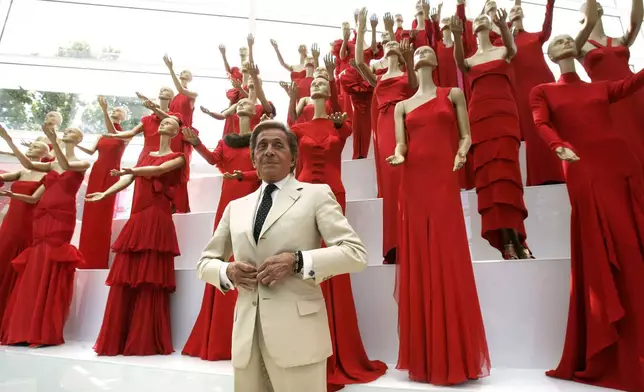 FILE - Italian fashion designer Valentino Garavani poses at an exhibition of his best creations at the Ara Pacis museum, part of the fashion designers 45th anniversary celebrations on Friday, July 6, 2007 in Rome. (AP Photo/Pier Paolo Cito, File)