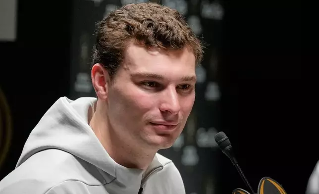 Indiana quarterback Fernando Mendoza speaks during media day ahead of the College Football Playoff national championship game between Miami and Indiana, Saturday, Jan. 17, 2026, in Miami. The game will be played on Monday. (AP Photo/Chris Carlson)