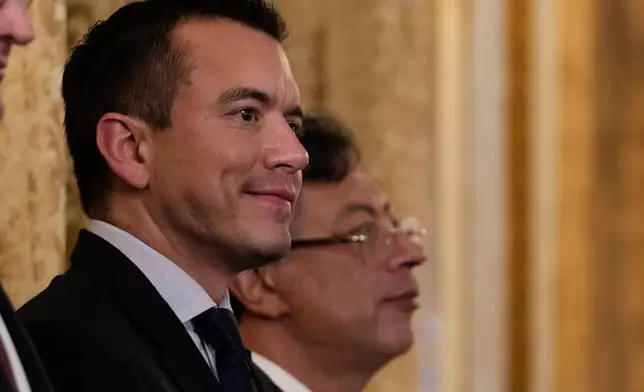 Ecuadorian President Daniel Noboa, left, and Colombian President Gustavo Petro attend a decoration ceremony for Brazilian President Luiz Inacio Lula da Silva at the presidential palace in Panama City, Wednesday, Jan. 28, 2026. (AP Photo/Matias Delacroix)