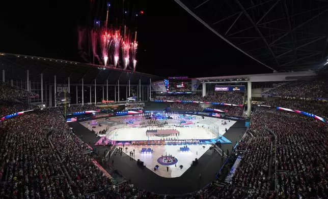Fireworks explode before the NHL Winter Classic outdoor hockey game between the Florida Panthers and the New York Rangers, Friday, Jan. 2, 2026, in Miami. (AP Photo/Rebecca Blackwell)