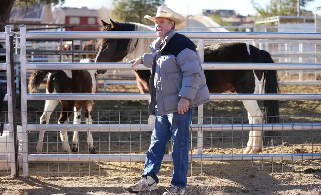 Isaac Wyler, a former member of The Fundamentalist Church of Jesus Christ of Latter-Day Saints (FLDS), poses with his horse Friday, Dec. 5, 2025, in Hildale, Utah. (AP Photo/Rick Bowmer)