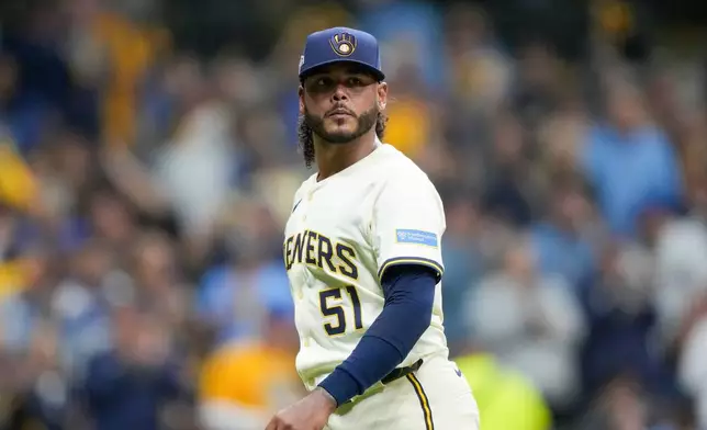 FILE - Milwaukee Brewers pitcher Freddy Peralta walks to the dugout after the top of the fifth inning in Game 2 of baseball's National League Championship Series against the Los Angeles Dodgers, Oct. 14, 2025, in Milwaukee. (AP Photo/Brynn Anderson, File)