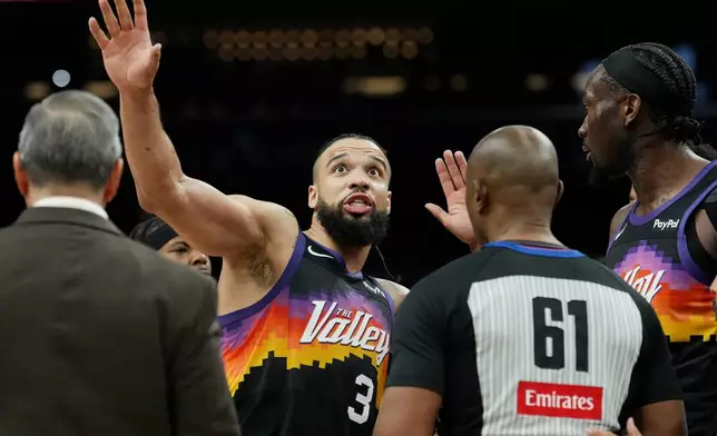 Phoenix Suns forward Dillon Brooks (3) argues with referee Courtney Kirkland (61) during the first half of an NBA basketball game, Friday, Jan. 9, 2026, in Phoenix. (AP Photo/Ross D. Franklin)