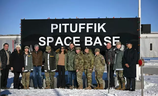 FILE - Vice President JD Vance, center right, and second lady Usha Vance, center left, pose with personnel at Pituffik Space Base in Greenland on March 28, 2025. (Jim Watson/Pool Photo via AP, File)
