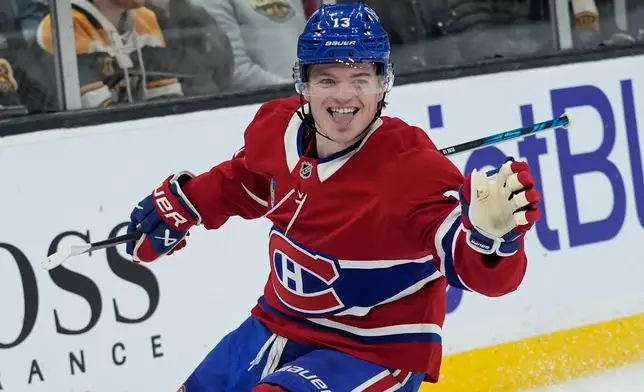 Montreal Canadiens right wing Cole Caufield celebrates after his goal during the first period of an NHL hockey game against the Boston Bruins in Boston, Saturday, Jan. 24, 2026. (AP Photo/Robert F. Bukaty)