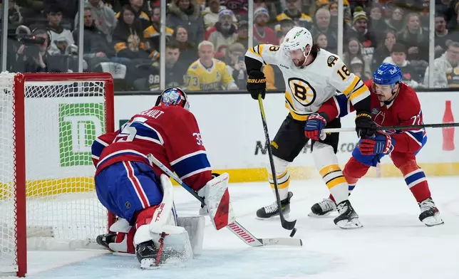 Montreal Canadiens goaltender Samuel Montembeault (35) stops Boston Bruins center Pavel Zacha (18) during the second period of an NHL hockey game in Boston, Saturday, Jan. 24, 2026. (AP Photo/Robert F. Bukaty)