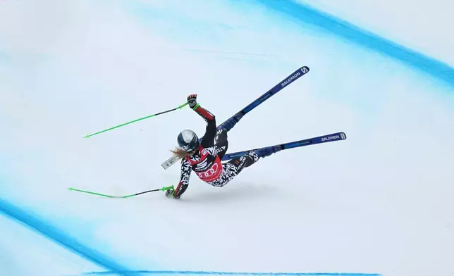 New Zealand's Alice Robinson crashes during an alpine ski, women's World Cup Super G, in Tarvisio, Italy, Sunday, Jan. 18, 2026. (AP Photo/Marco Trovati)