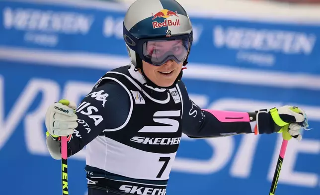 United States' Lindsey Vonn celebrates at the finish area of an alpine ski, women's World Cup Super G, in Tarvisio, Italy, Sunday, Jan. 18, 2026. (AP Photo/Marco Trovati)