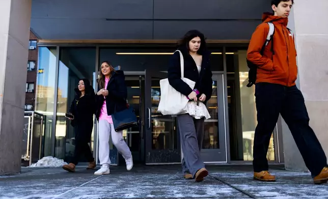 Students walk out of South Quad on the University of Michigan campus in Ann Arbor, Mich., Jan. 17, 2026. (AP Photo/Emily Elconin)