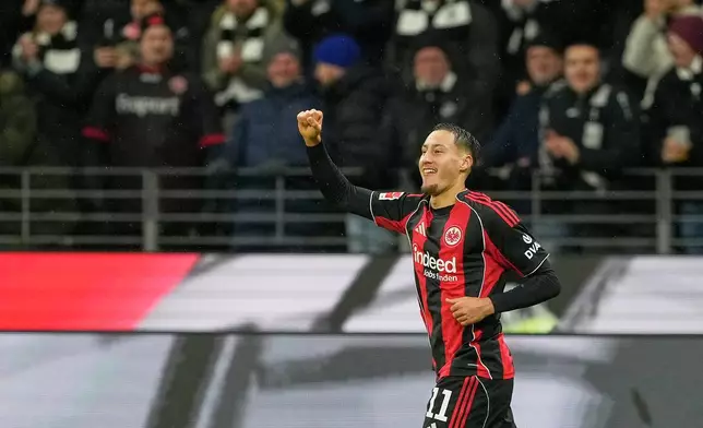 Frankfurt's Younes Ebnoutalib celebrates after scoring his side's second goal during the Bundesliga soccer match between Eintracht Frankfurt and Borussia Dortmund in Frankfurt, Germany, Friday, Jan. 9, 2026. (AP Photo/Michael Probst)