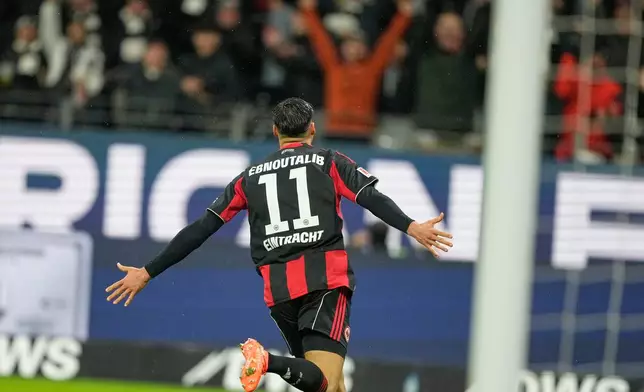 Frankfurt's Younes Ebnoutalib celebrates after scoring his side's second goal during the Bundesliga soccer match between Eintracht Frankfurt and Borussia Dortmund in Frankfurt, Germany, Friday, Jan. 9, 2026. (AP Photo/Michael Probst)