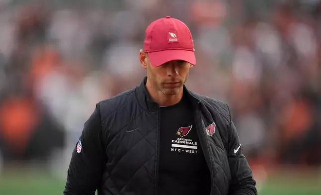 Arizona Cardinals head coach Jonathan Gannon leaves the field after an NFL football game against the Cincinnati Bengals, Sunday, Dec. 28, 2025, in Cincinnati. (AP Photo/Joshua A. Bickel)
