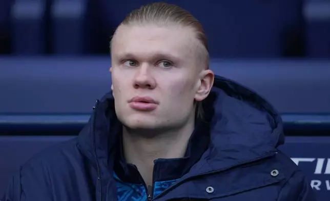 Manchester City's Erling Haaland sits in the dug out before the start of the English Premier League soccer match between Manchester City and Wolverhampton Wanderers in Manchester, England, Saturday, Jan. 24, 2026. (AP Photo/Ian Hodgson)
