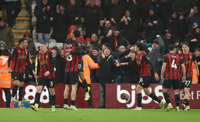 Bournemouth's Amine Adli, center( 21), celebrates with teammates after scoring his sides third goal during the English Premier League soccer match between Bournemouth and Liverpool in Bournemouth, England, Saturday, Jan. 24, 2026. (AP Photo/Ian Walton)
