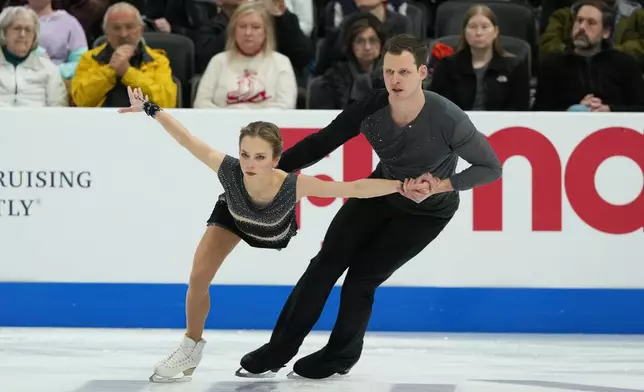 Alisa Efimova and Misha Mitrofanov compete during the pairs short program at the U.S. Figure Skating Championships, Wednesday, Jan. 7, 2026, in St. Louis. (AP Photo/Stephanie Scarbrough)