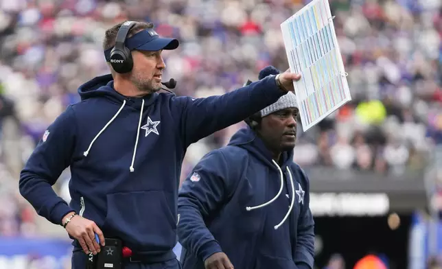Dallas Cowboys head coach Brian Schottenheimer reacts after a touchdown against the New York Giants during the first quarter of an NFL football game, Sunday, Jan. 4, 2026, in East Rutherford, N.J. (AP Photo/Frank Franklin)