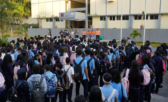 Children return to school after the holiday break in Caracas, Venezuela, Monday, Jan. 12, 2026. (AP Photo/Matias Delacroix)