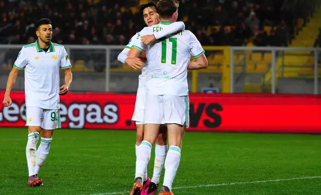 Roma's Evan Ferguson, back to camera, celebrates after scoring during the Serie A soccer match between Lecce and Roma, in Lecce, Italy, Tuesday, Jan. 6, 2026. (Giovanni Evangelista/LaPresse via AP)