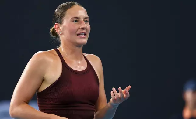 Marta Kostyuk of Ukraine reacts after missing a shot during the women's final match against Aryna Sabalenka of Belarus at the Brisbane International tennis tournament in Brisbane, Australia, Sunday, Jan. 11, 2026. (AP Photo/Tertius Pickard)