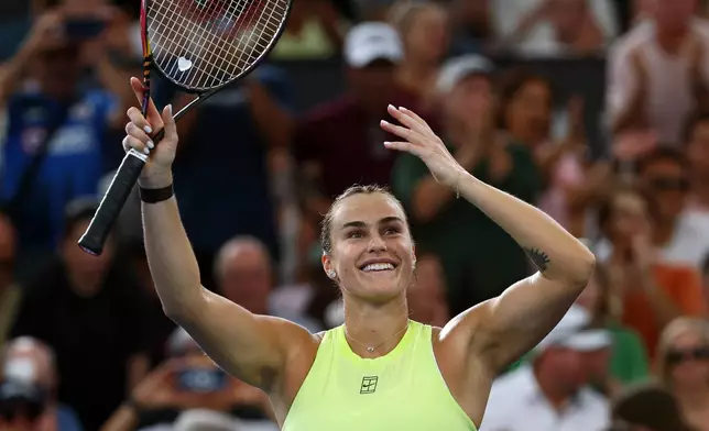 Aryna Sabalenka of Belarus waves to the crowd after winning the women's final match against Marta Kostyuk of Ukraine 6-4, 6-3, at the Brisbane International tennis tournament in Brisbane, Australia, Sunday, Jan. 11, 2026. (AP Photo/Tertius Pickard)