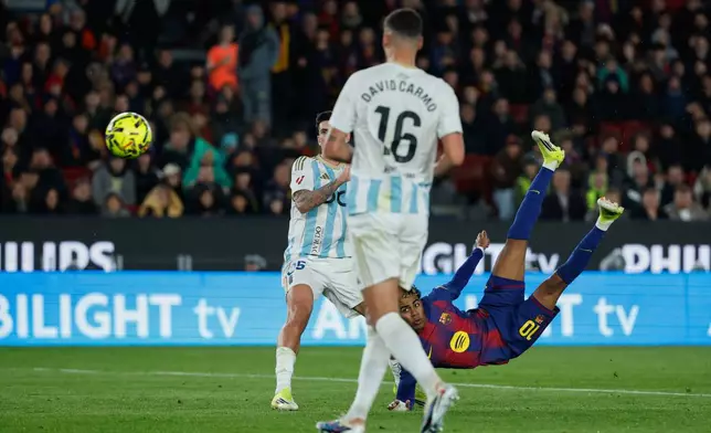 Barcelona's Lamine Yamal scores his side's third goal during a Spanish La Liga soccer match between Barcelona and Real Oviedo in Barcelona, Spain, Sunday, Jan. 25, 2026. (AP Photo/Joan Monfort)
