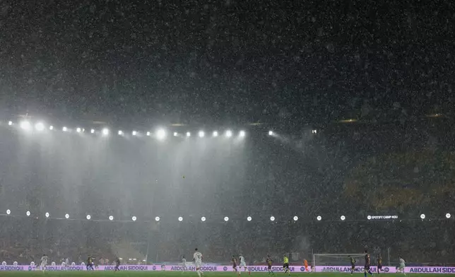 A heavy rain falls on the field during a Spanish La Liga soccer match between Barcelona and Real Oviedo in Barcelona, Spain, Sunday, Jan. 25, 2026. (AP Photo/Joan Monfort)